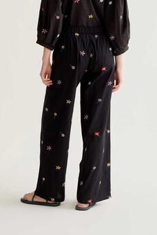 Pantaloni con fiori ricamati
